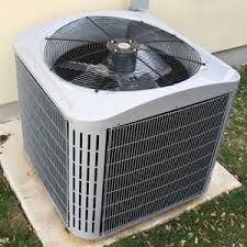 Air Conditioning condenser next to a home.