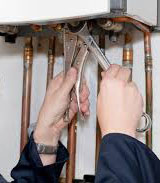 Gas leak repair on a water heater.